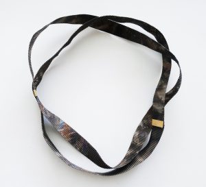 "Fortuny Ribbon," necklace, 2012, steel ribbon, oxidations, enamel, gold